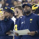 Jim Harbaugh and Sherrone Moore